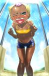  1girl blonde_hair blue_eyes blush boro chat dark_skin legs midriff navel one_eye_closed open_mouth sharp_teeth short_hair shorts shower small_breasts solo tales_of_(series) tales_of_eternia tan tan_line tomboy wink 