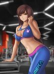  1girl adapted_costume alluring animal_print arm_support artist_logo athletic_female bangs blizzard_entertainment blue_pants blue_sports_bra blurry blurry_background breasts brown_eyes brown_hair bunny_print cleavage cleavage_cutout clenched_hand clothing_cutout collarbone commentary cowboy_shot d.va d.va_(overwatch) detailed_background english_commentary exercise_machine facepaint facial_mark female_abs fit_female flowerxl gym hana_song indoors long_hair looking_at_viewer medium_breasts midriff no_headwear overwatch overwatch_2 pants parted_lips skin_tight sports_bra swept_bangs tight tight_pants whisker_markings widescreen 